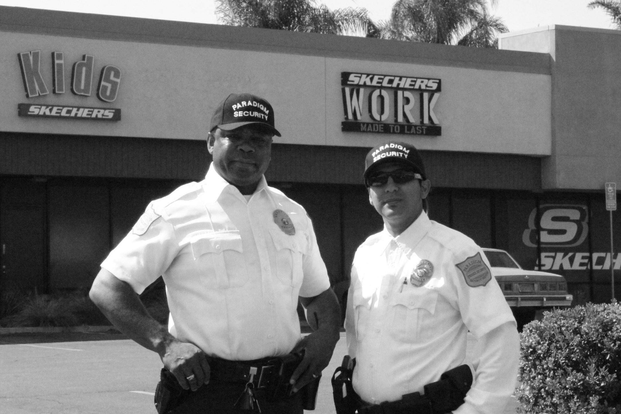Two Paradigm Security officers outside a client property